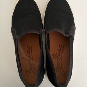 Black Canvas deck shoe sneaker slip on by Zodiac.